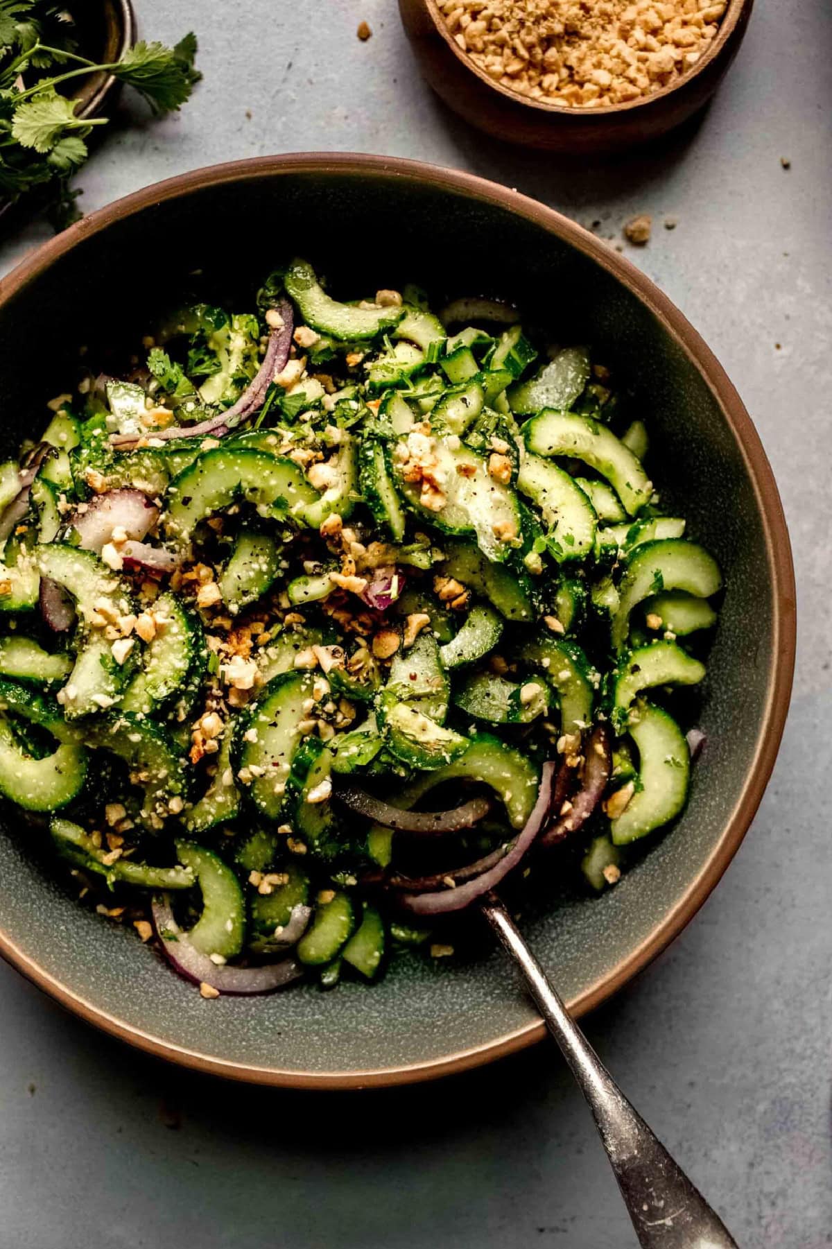 bowl of thai cucumber salad with spoon