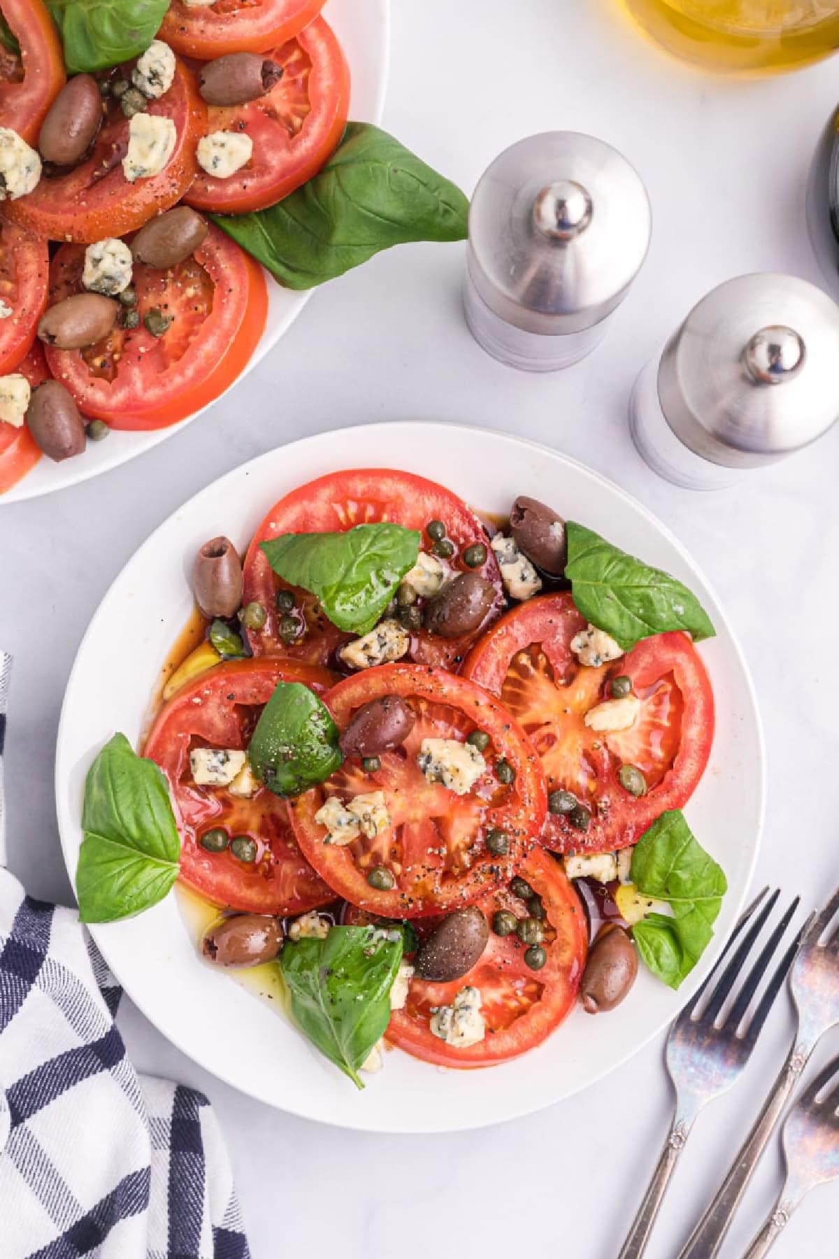plate of tomato caper and blue cheese salad