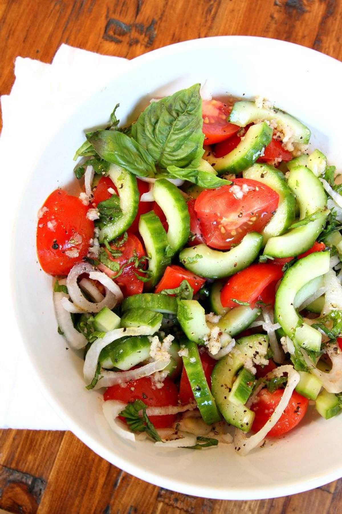 bowl of tomato cucumber and basil salad