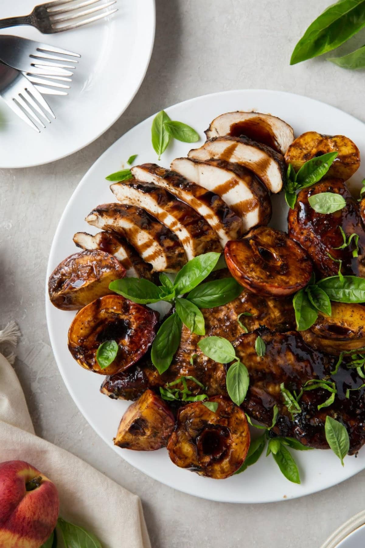 grilled chicken and peaches on plate