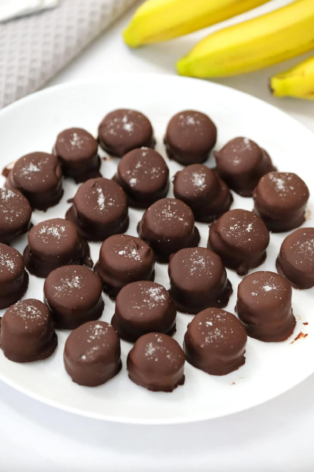 chocolate covered peanut butter banana bites on plate