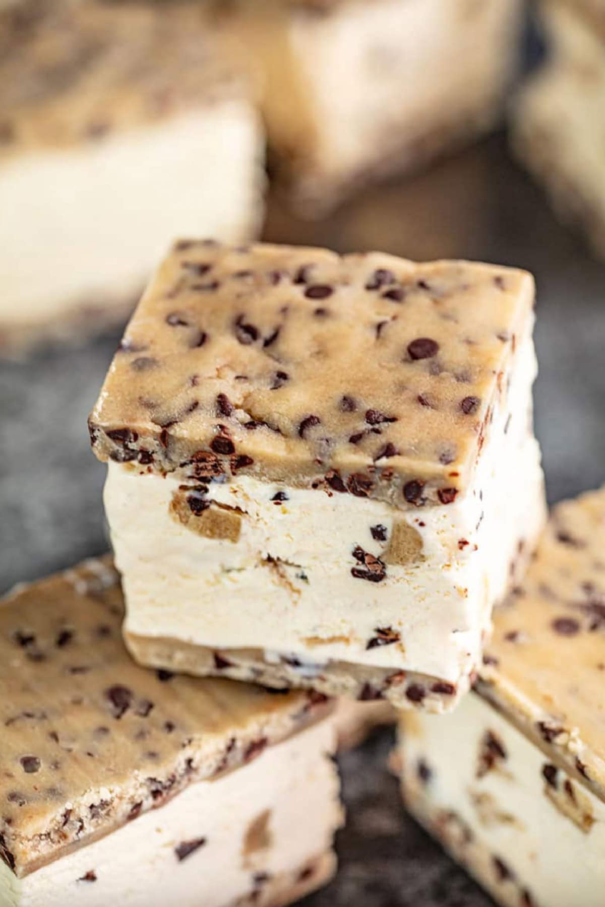 several cookie dough ice cream sandwiches stacked