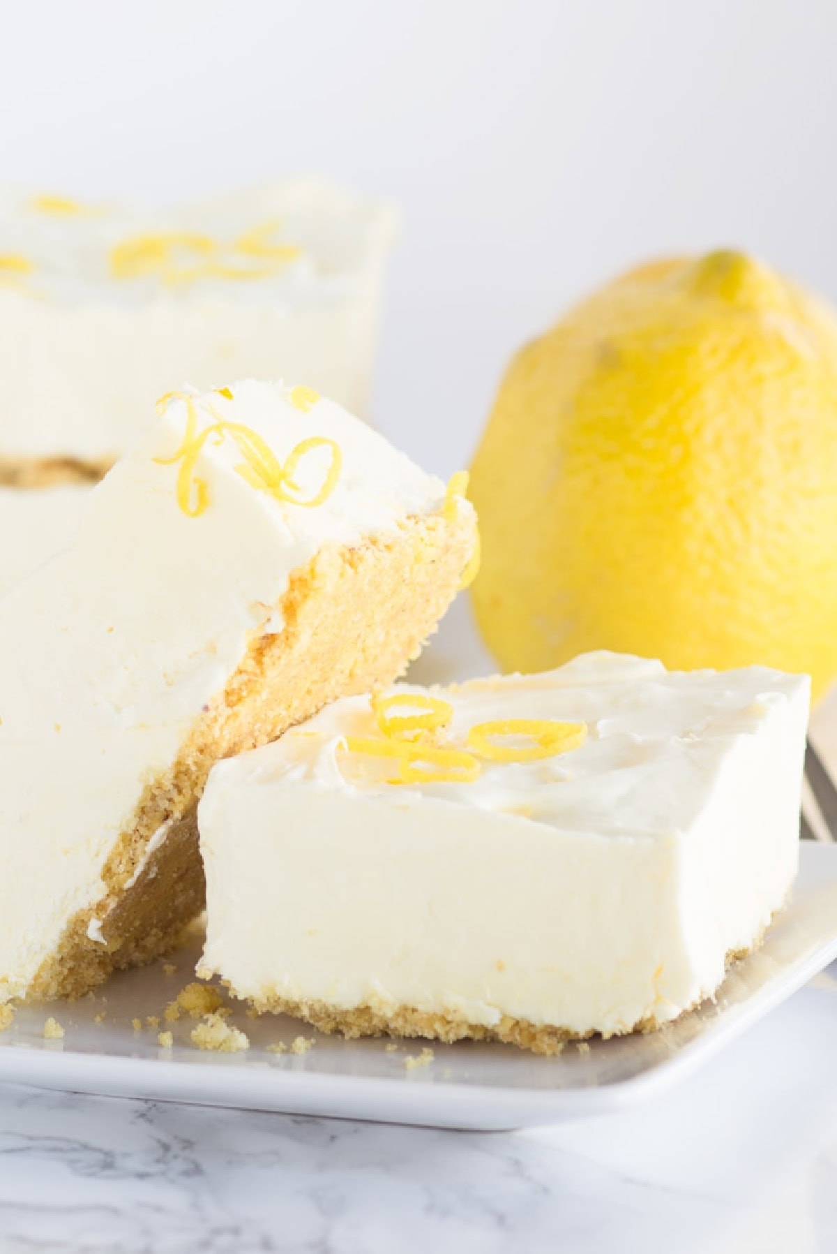 two frozen lemon cheesecake squares