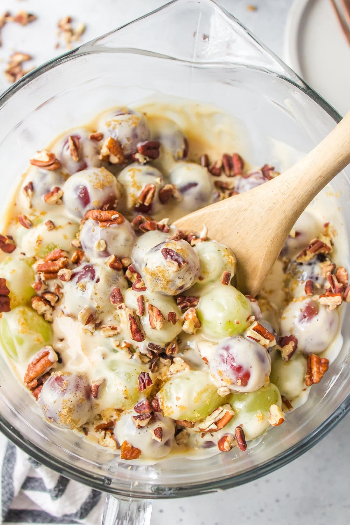 grape salad in bowl with spoon