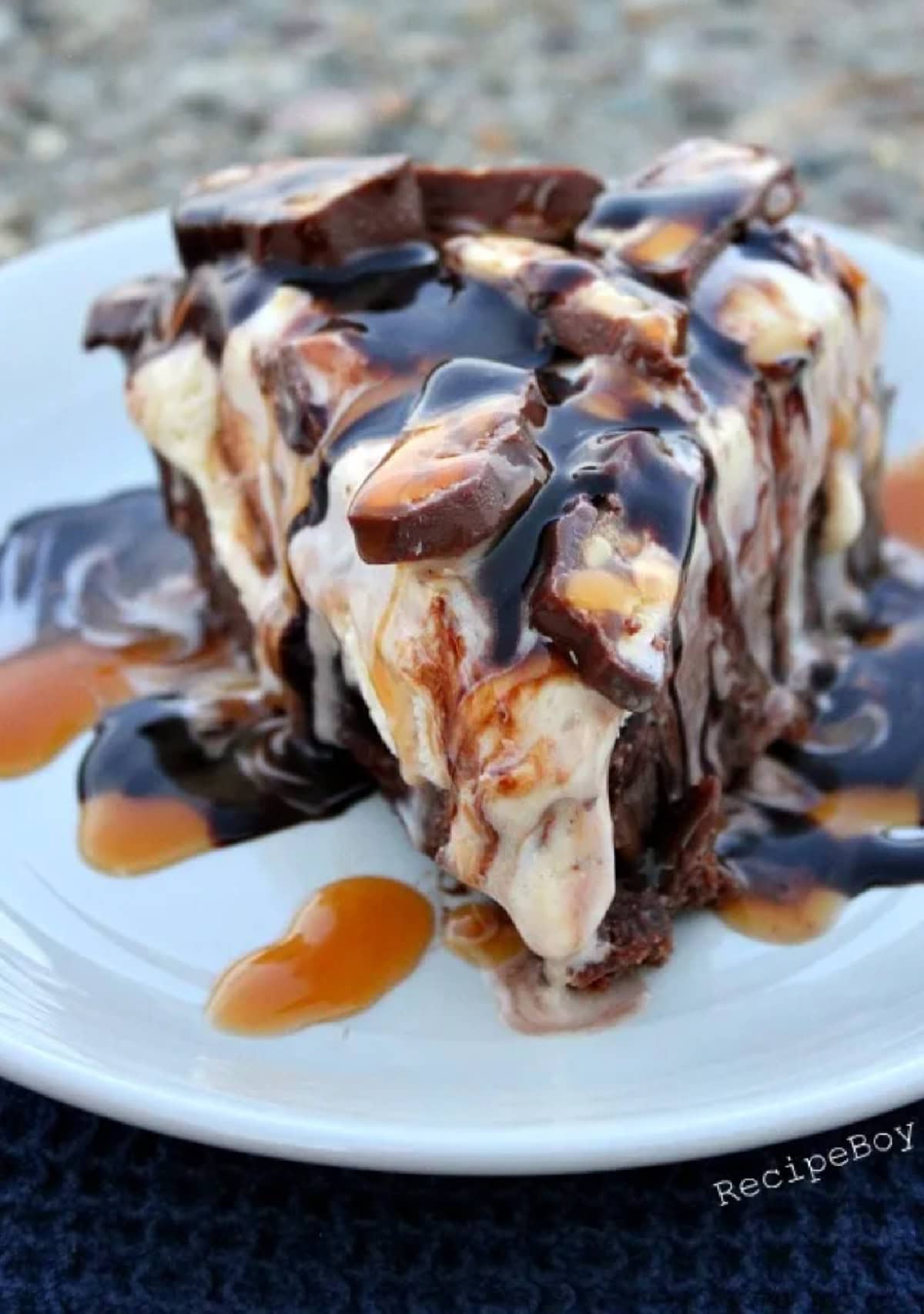 slice of snickers ice cream brownie pie on plate