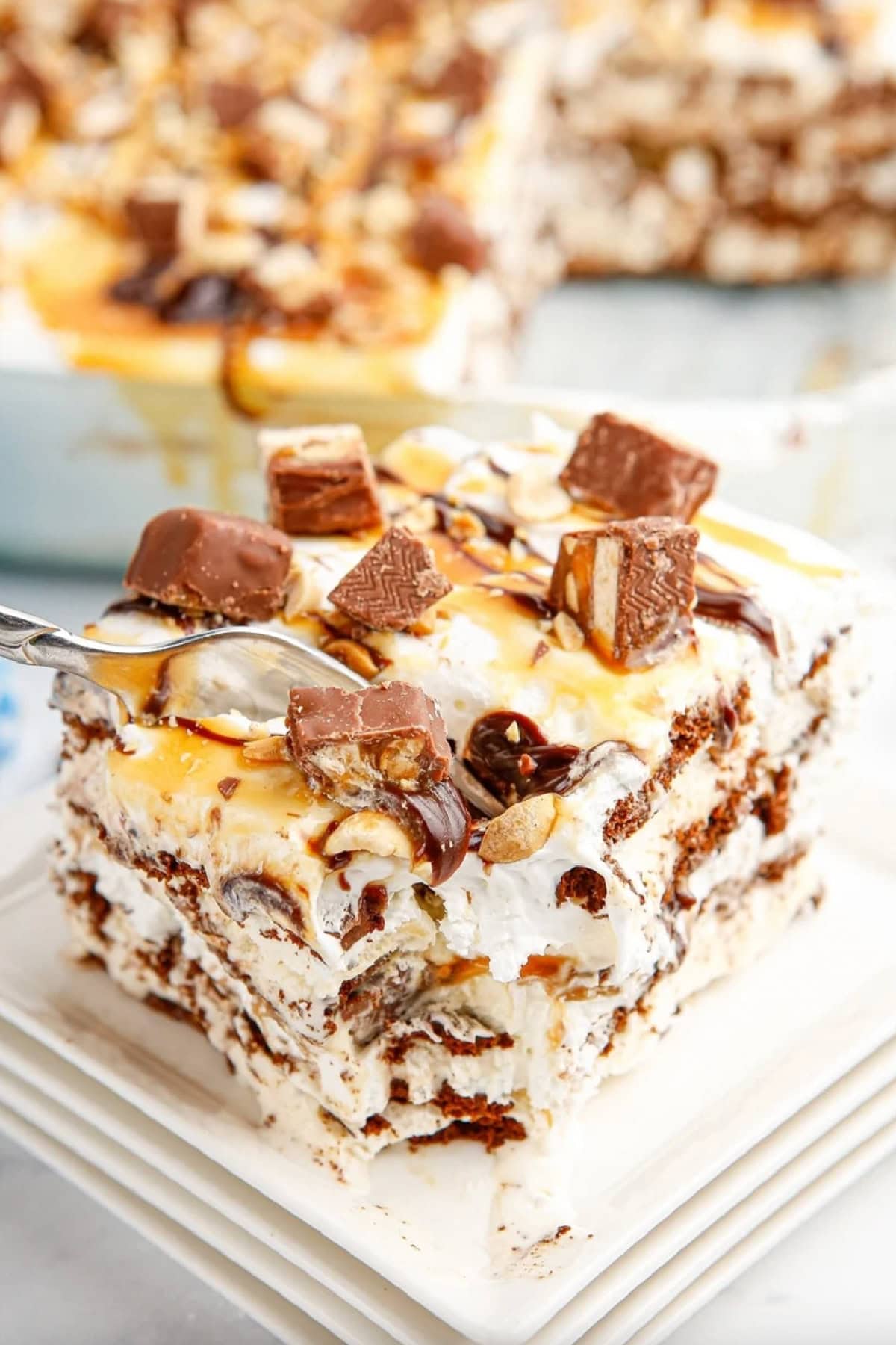 slice of snickers ice cream sandwich cake on plate