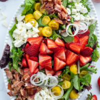 berry bacon and tomato salad on platter