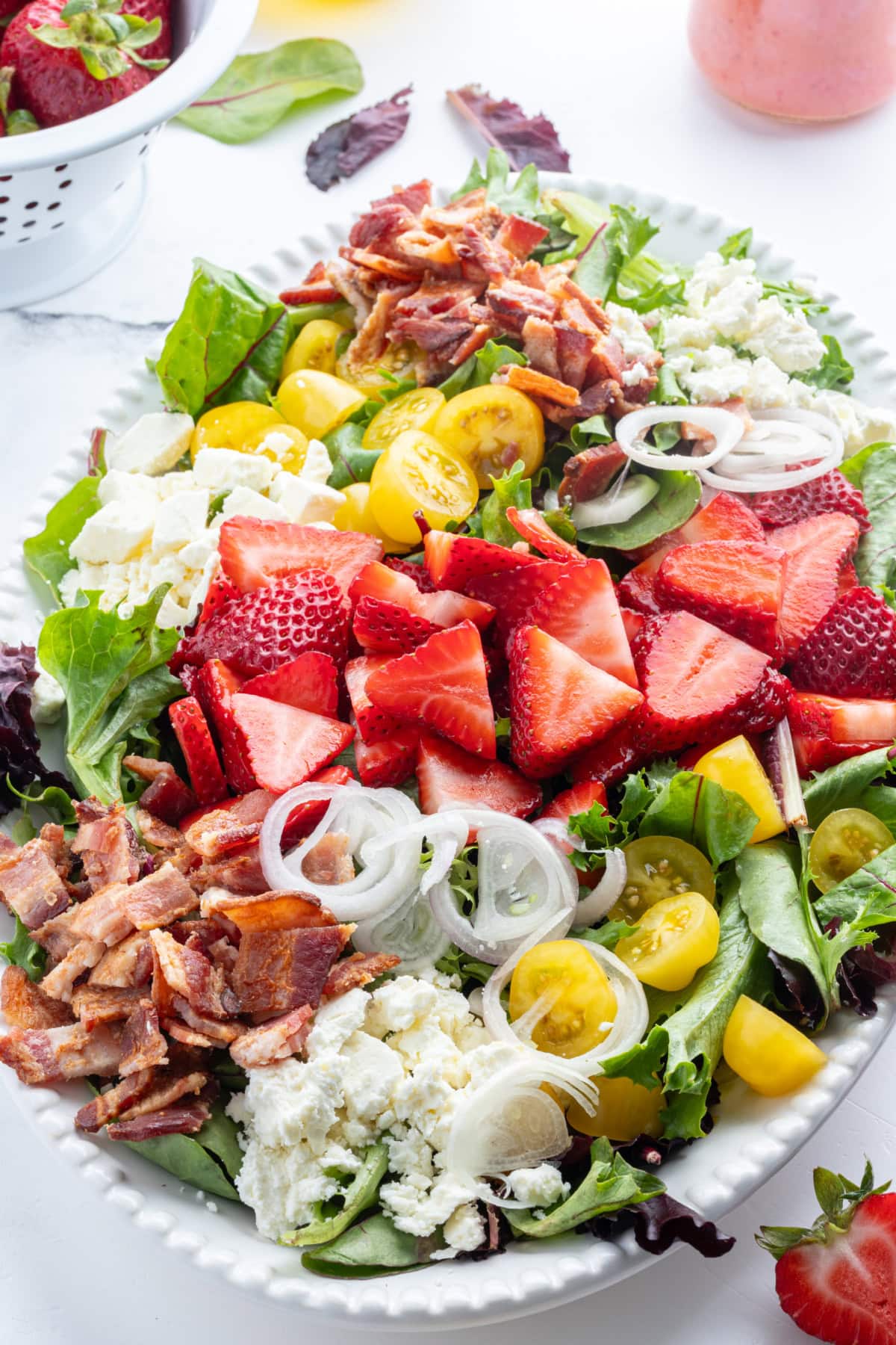 berry bacon and tomato salad on big white plate