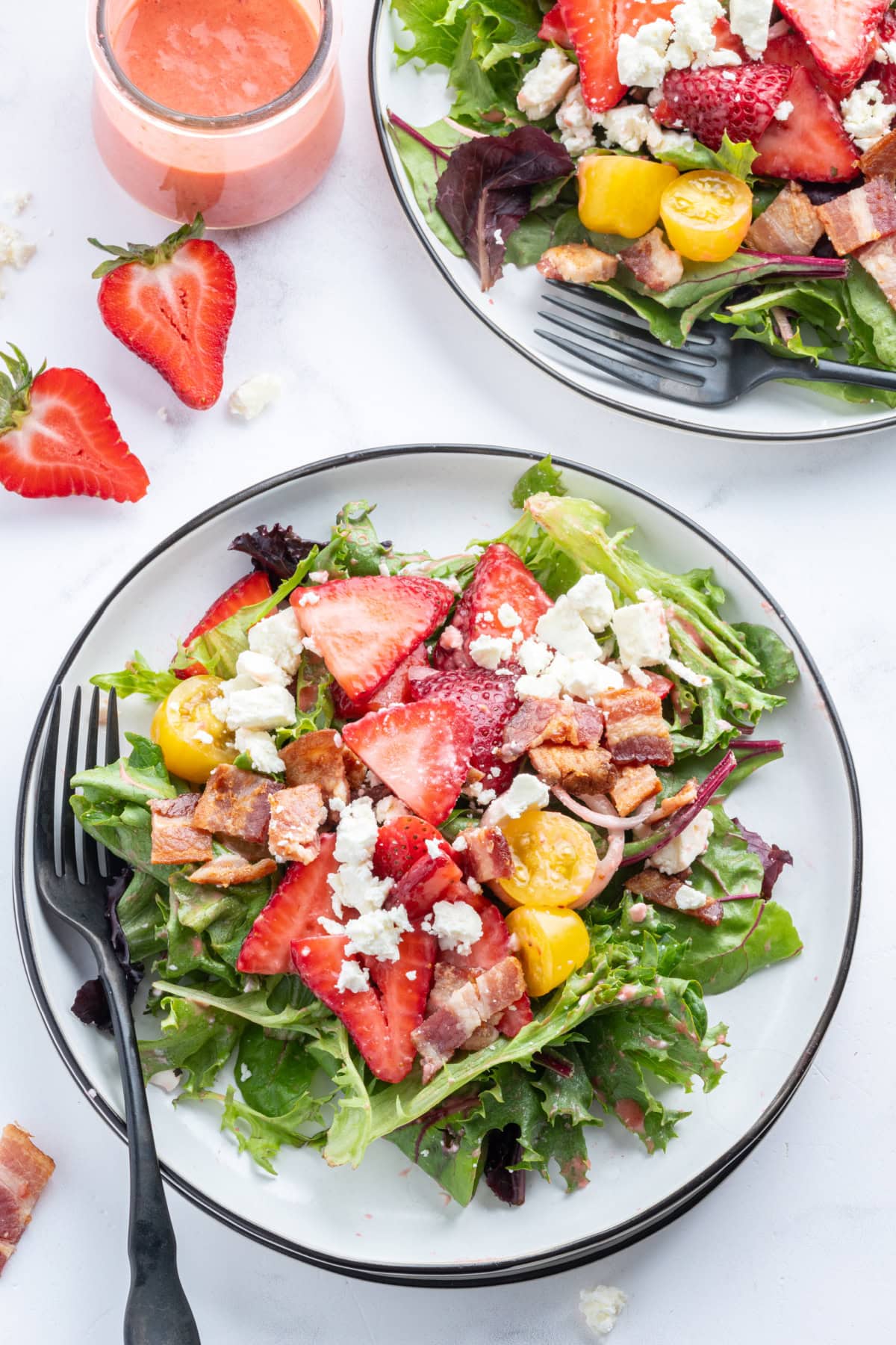 serving of berry bacon and tomato salad on plate