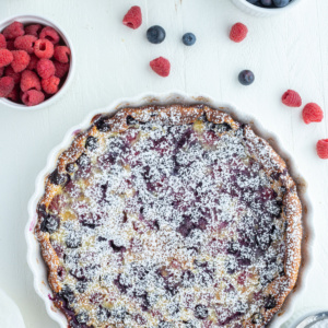 whole berry clafoutis french dessert in white dish