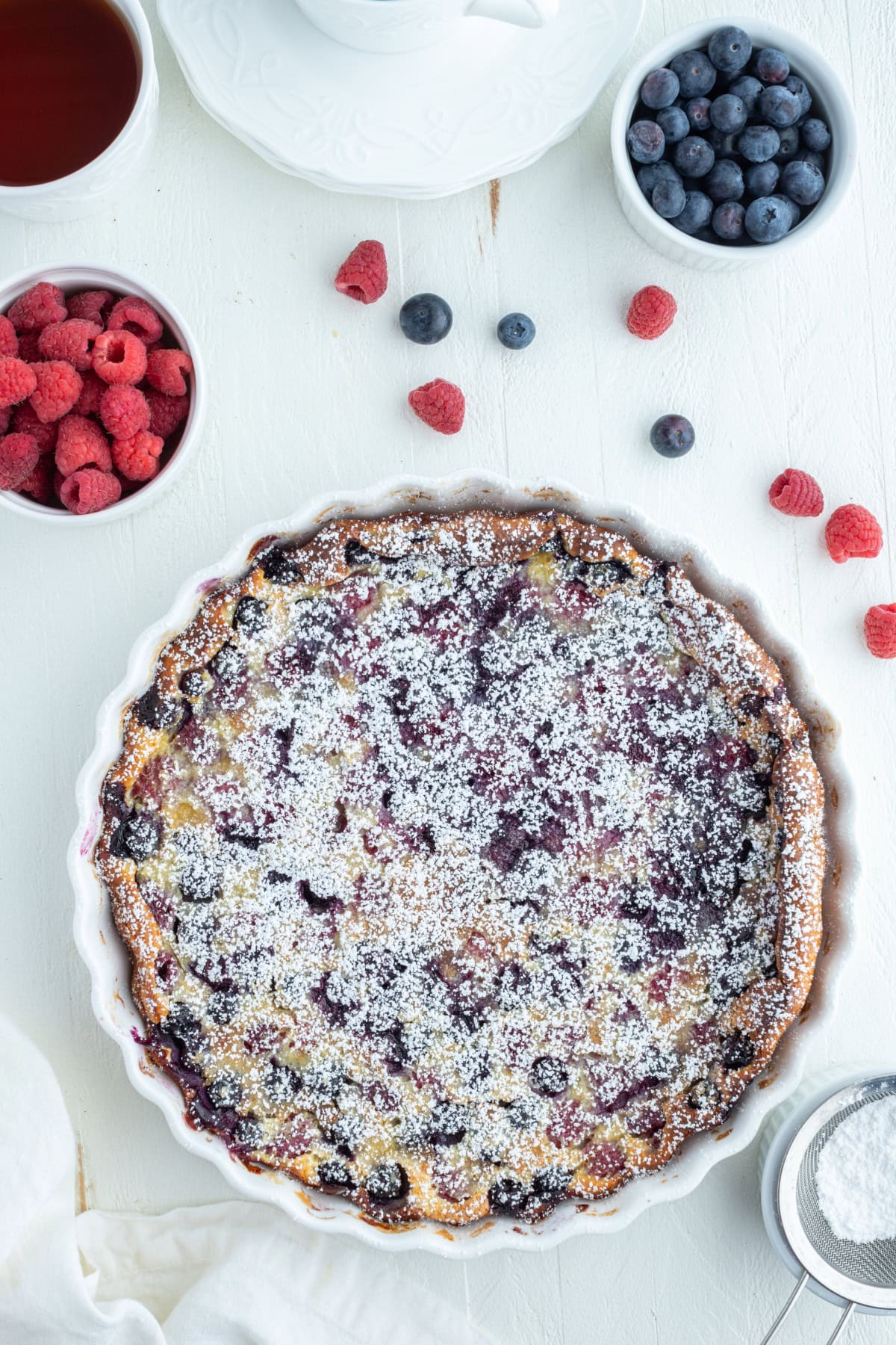 whole berry clafoutis french dessert in white dish