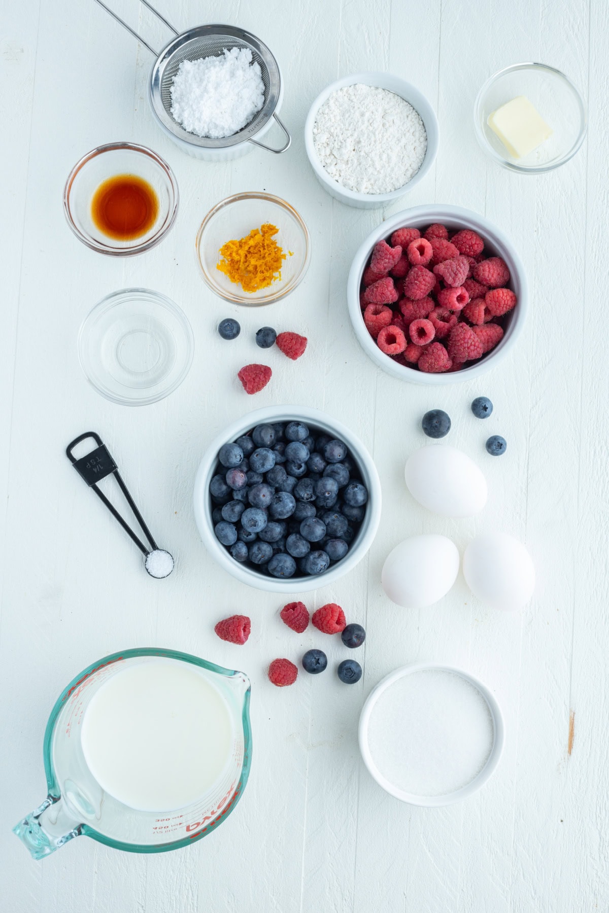 ingredients displayed for making berry clafoutis