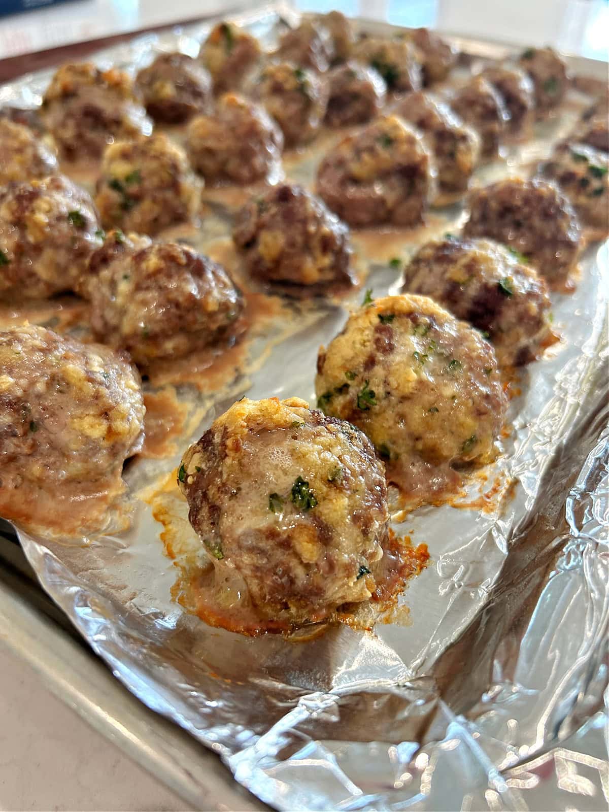 meatballs on baking sheet just out of the oven