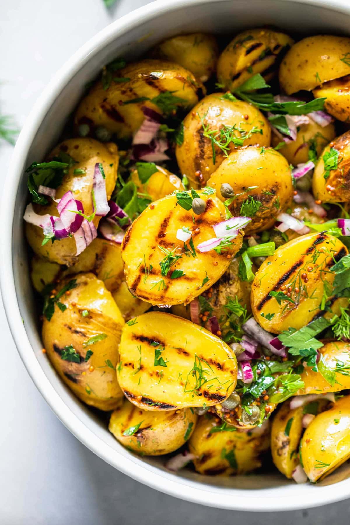 Grilled Potato Salad with Tangy Mustard Dressing in bowl