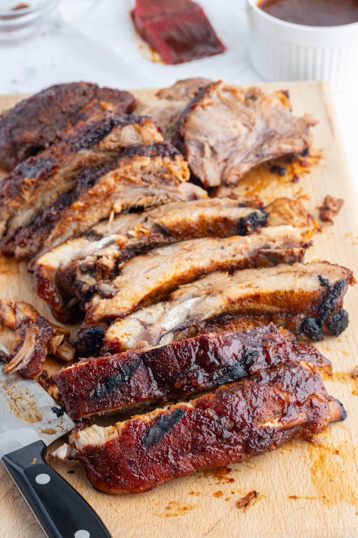 kansas city style ribs on a board sliced