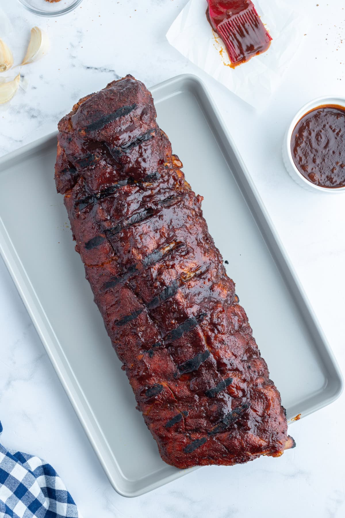 kansas city style ribs slab on a baking sheet