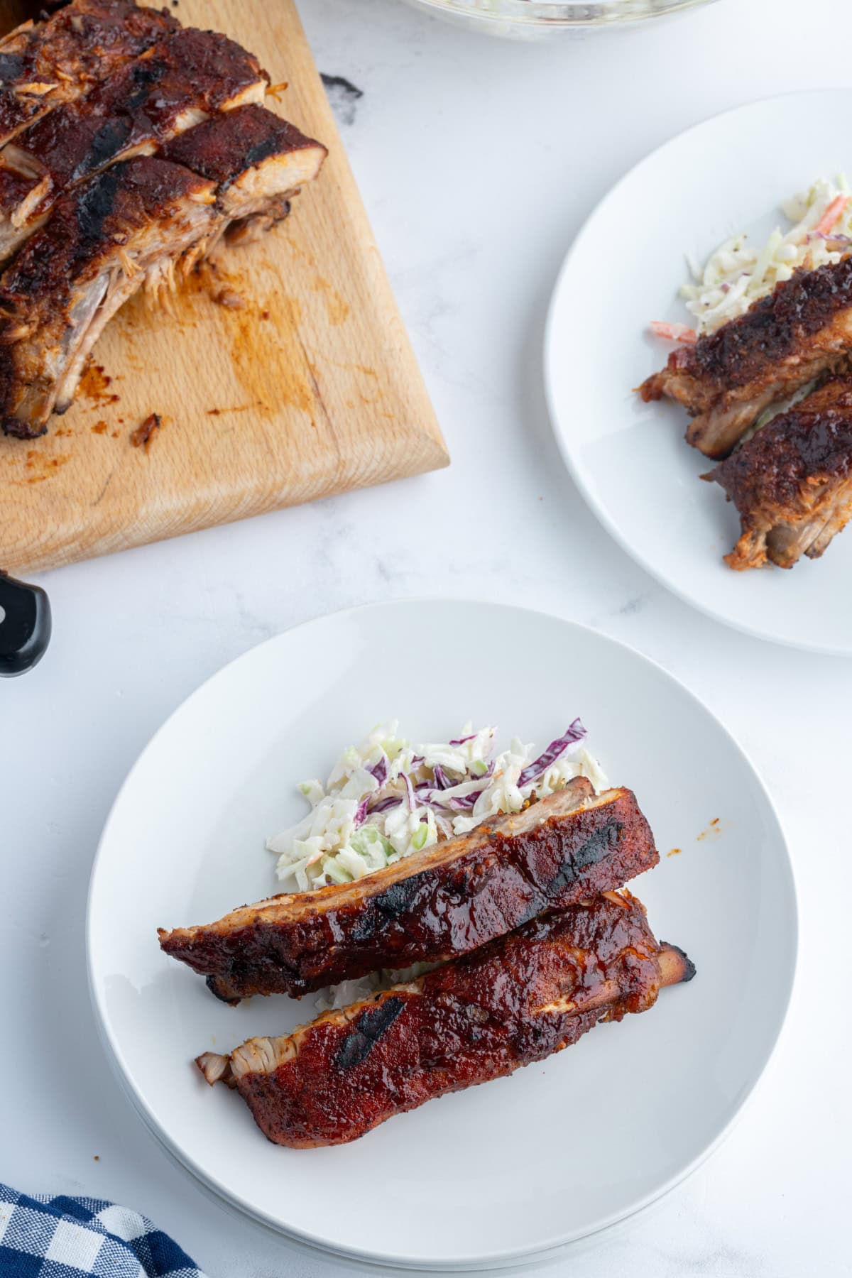 kansas city style ribs on a plate with cole slaw