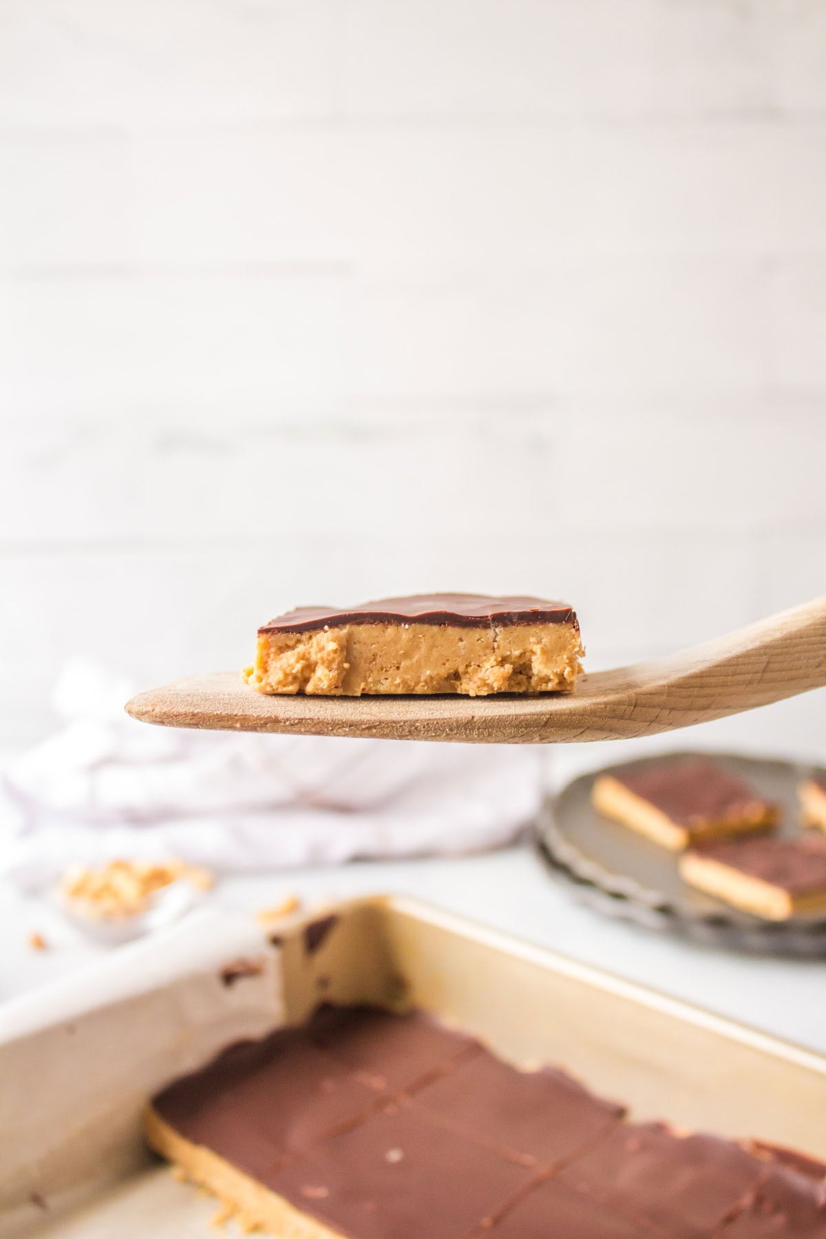 spatula holding no bake peanut butter bar