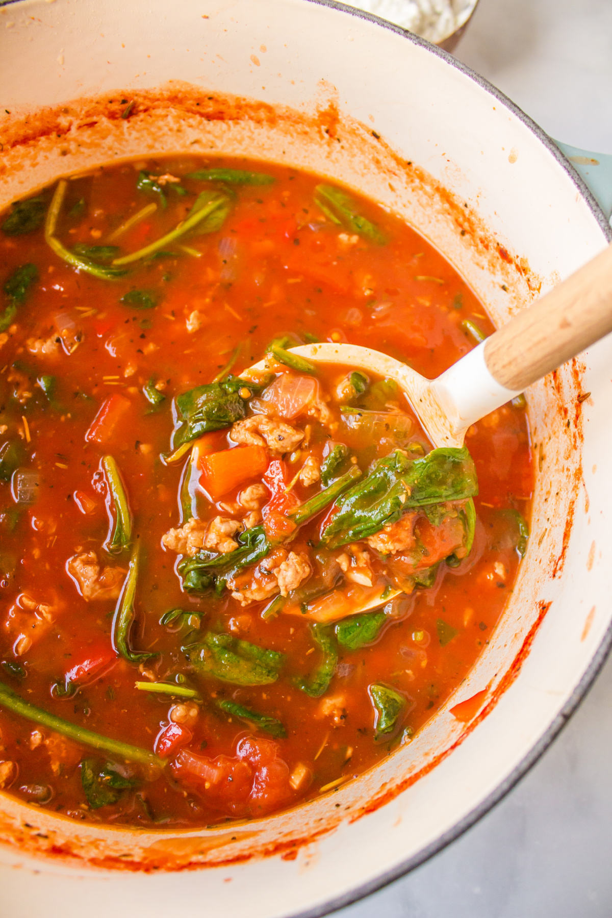 pot of unstuffed shells soup with ladle