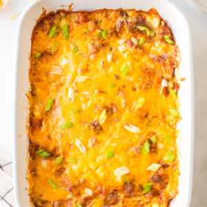 pinterest image for overnight croissant ham and cheese breakfast casserole