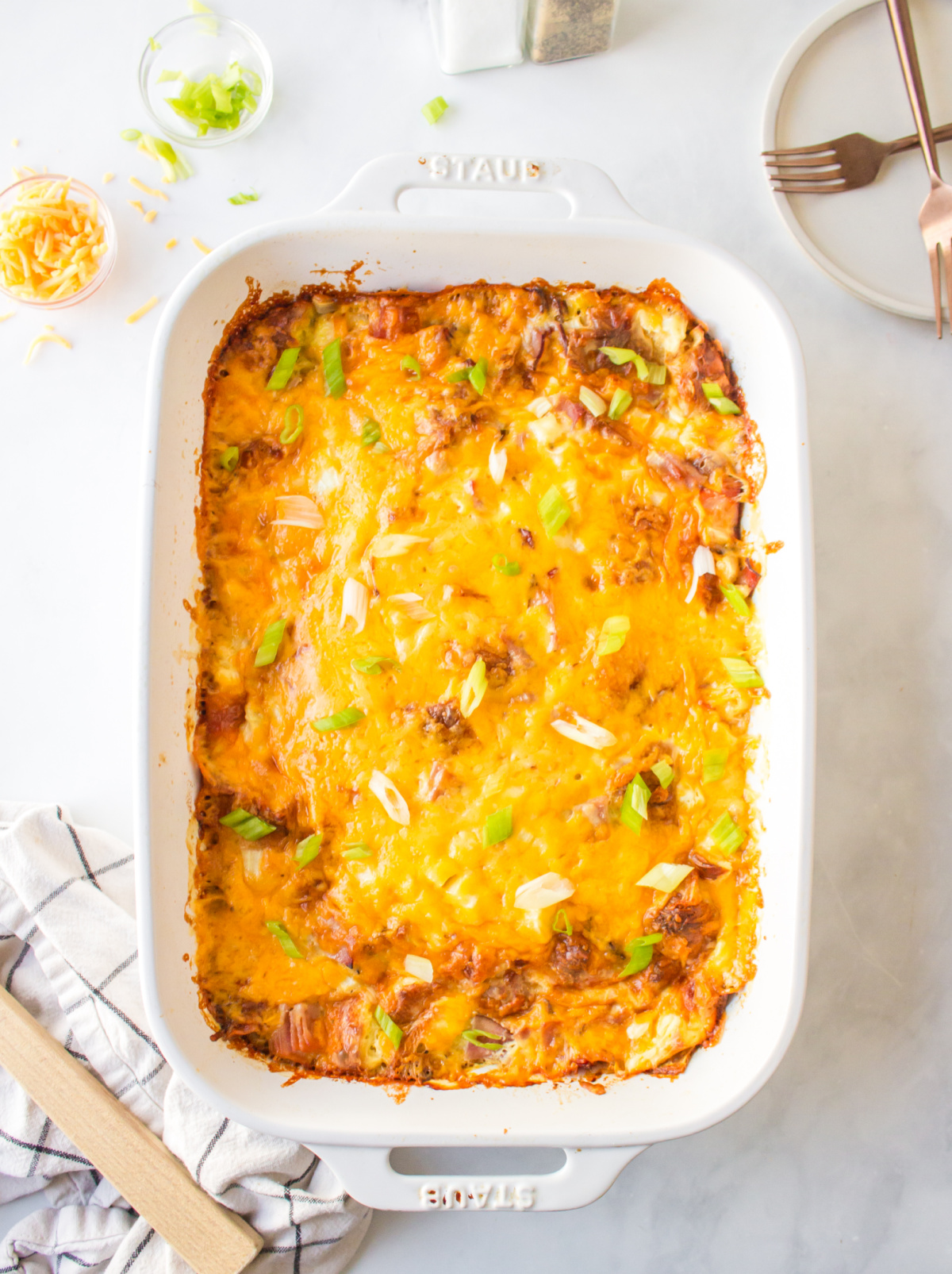 casserole dish of overnight croissant ham and cheese breakfast casserole