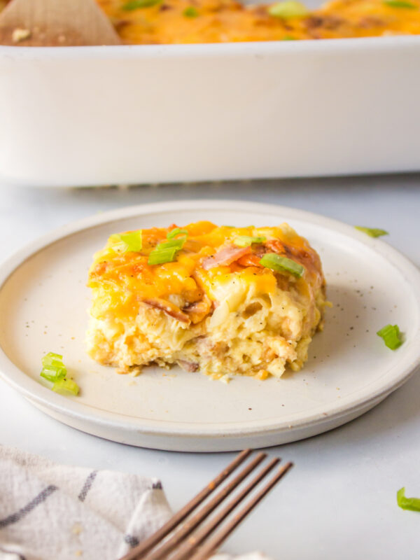 slice of overnight croissant ham and cheese breakfast casserole on plate