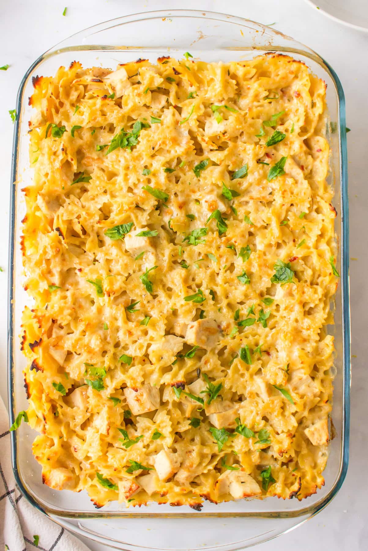 creamy lemon chicken pasta in a casserole dish