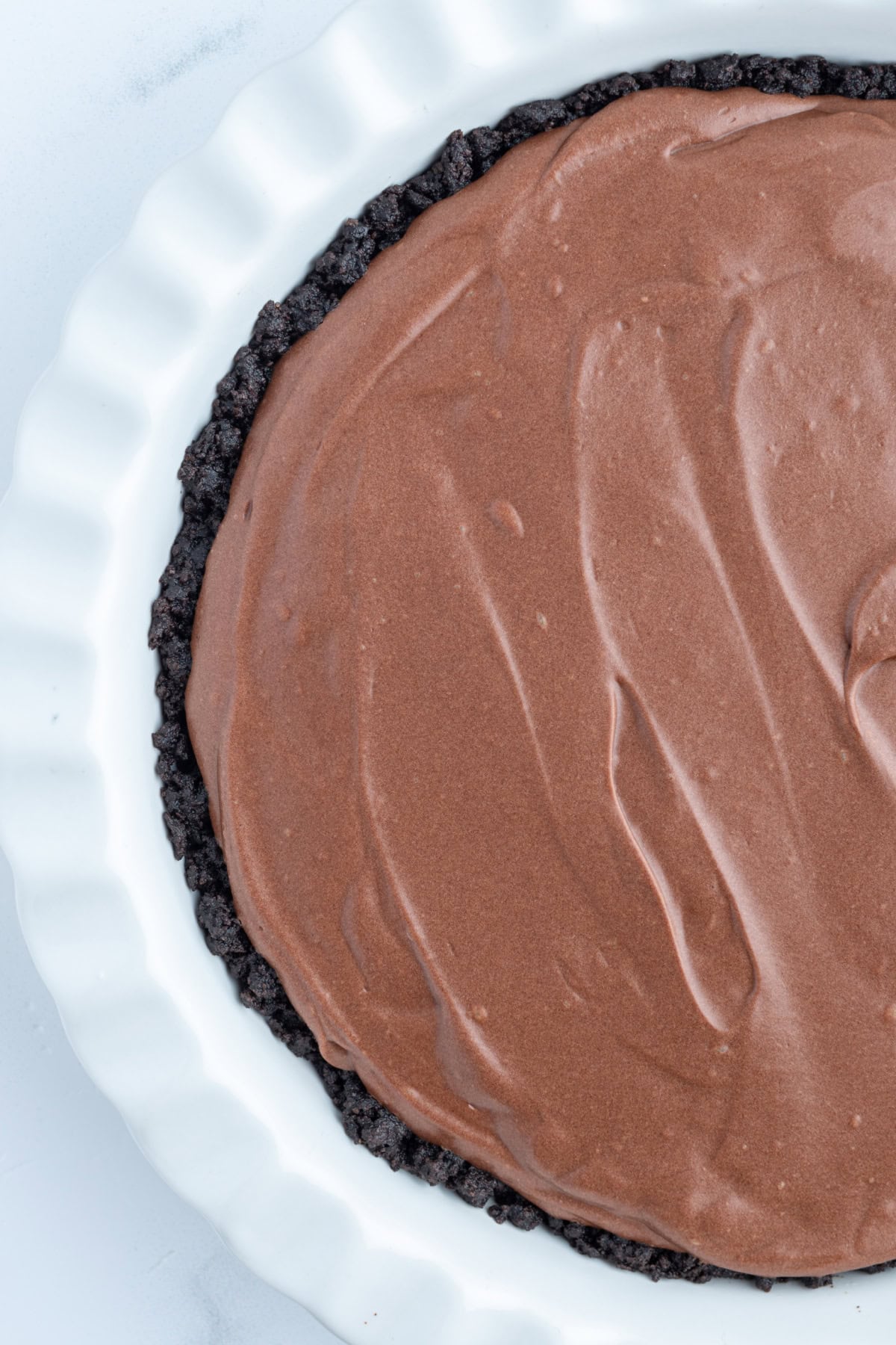 overhead shot of half of a chocolate truffle pie