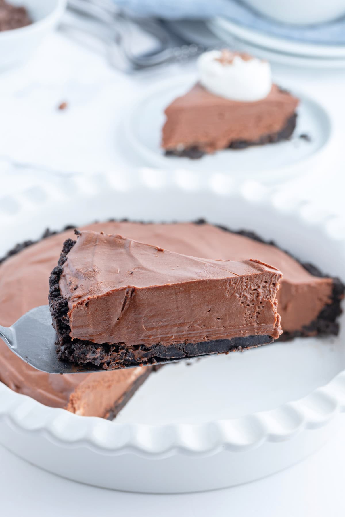 spatula holding slice of no bake easy chocolate truffle pie