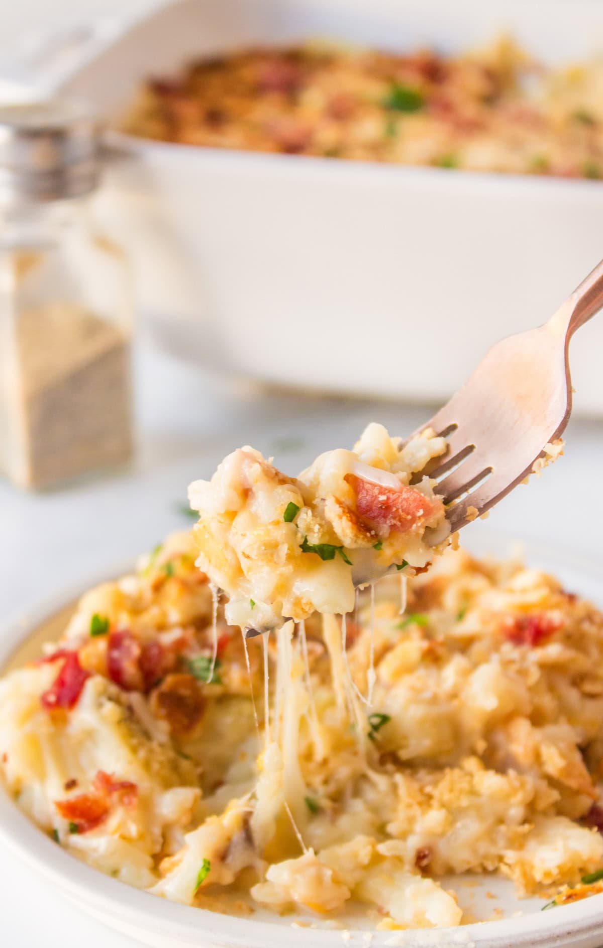 fork taking out forkful of funeral potatoes