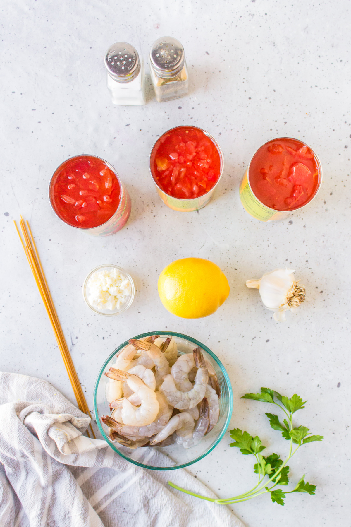 ingredients displayed for making greek shrimp pasta