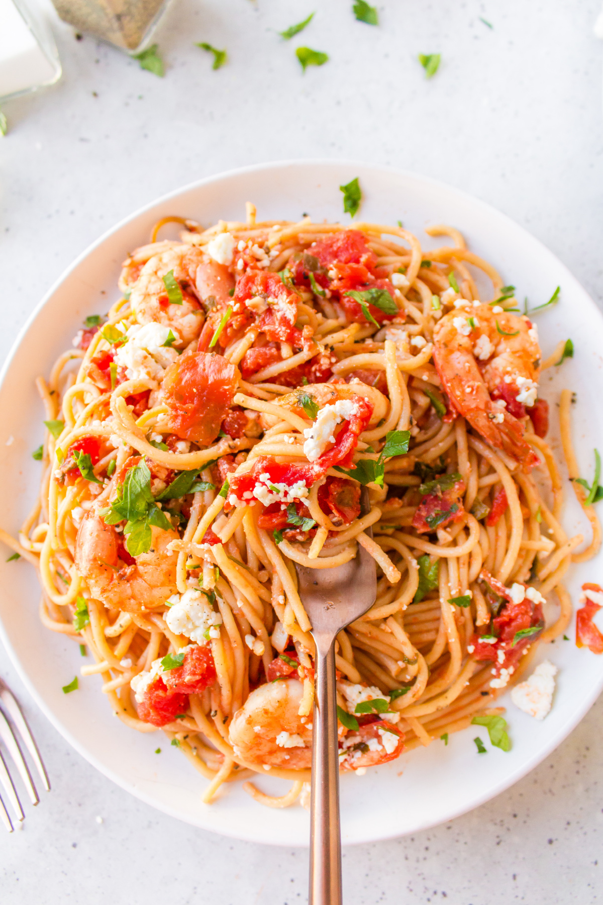 fork on plate of greek shrimp pasta