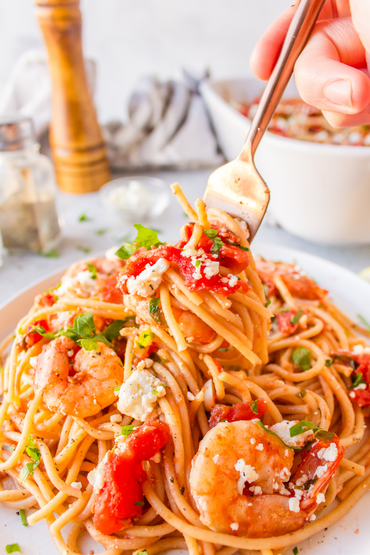 fork in serving of greek shrimp pasta