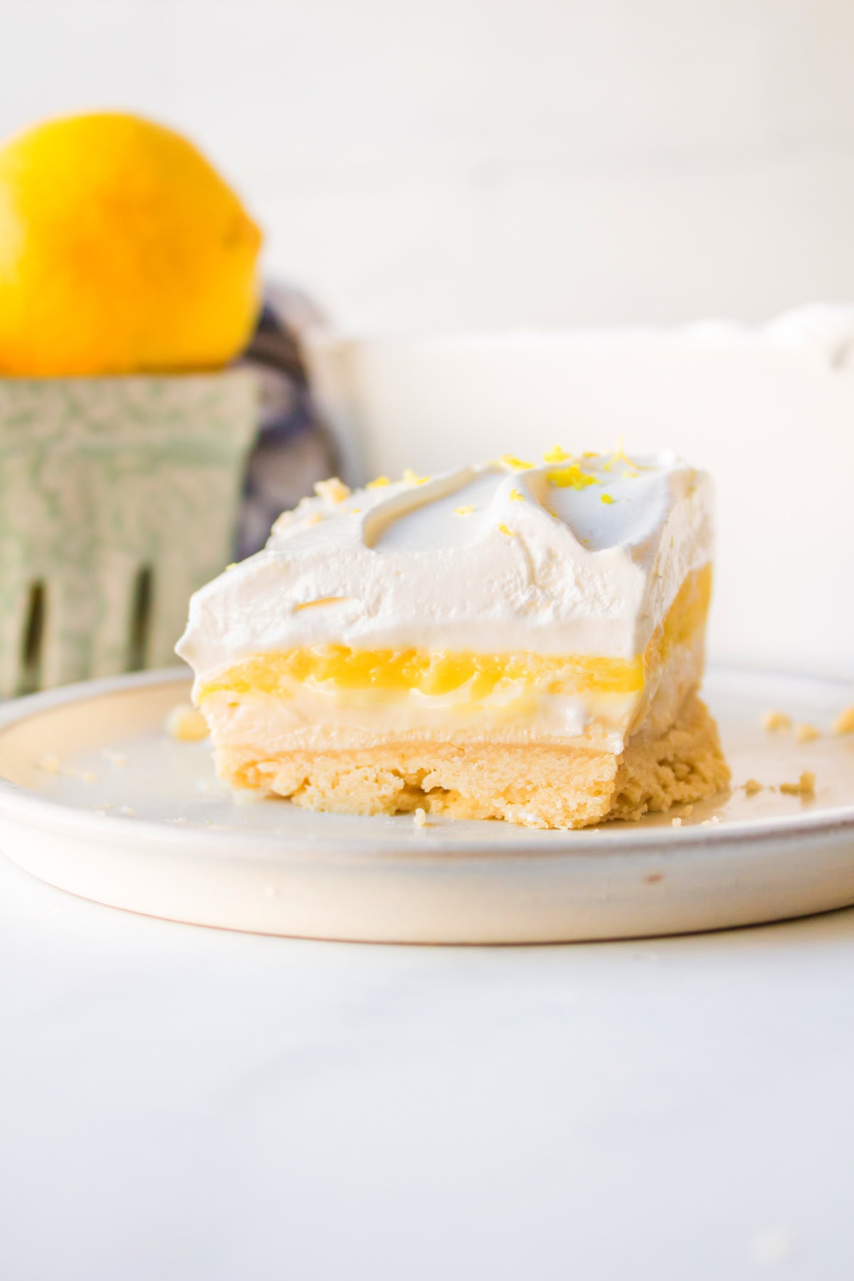 serving of lemon lush on a plate