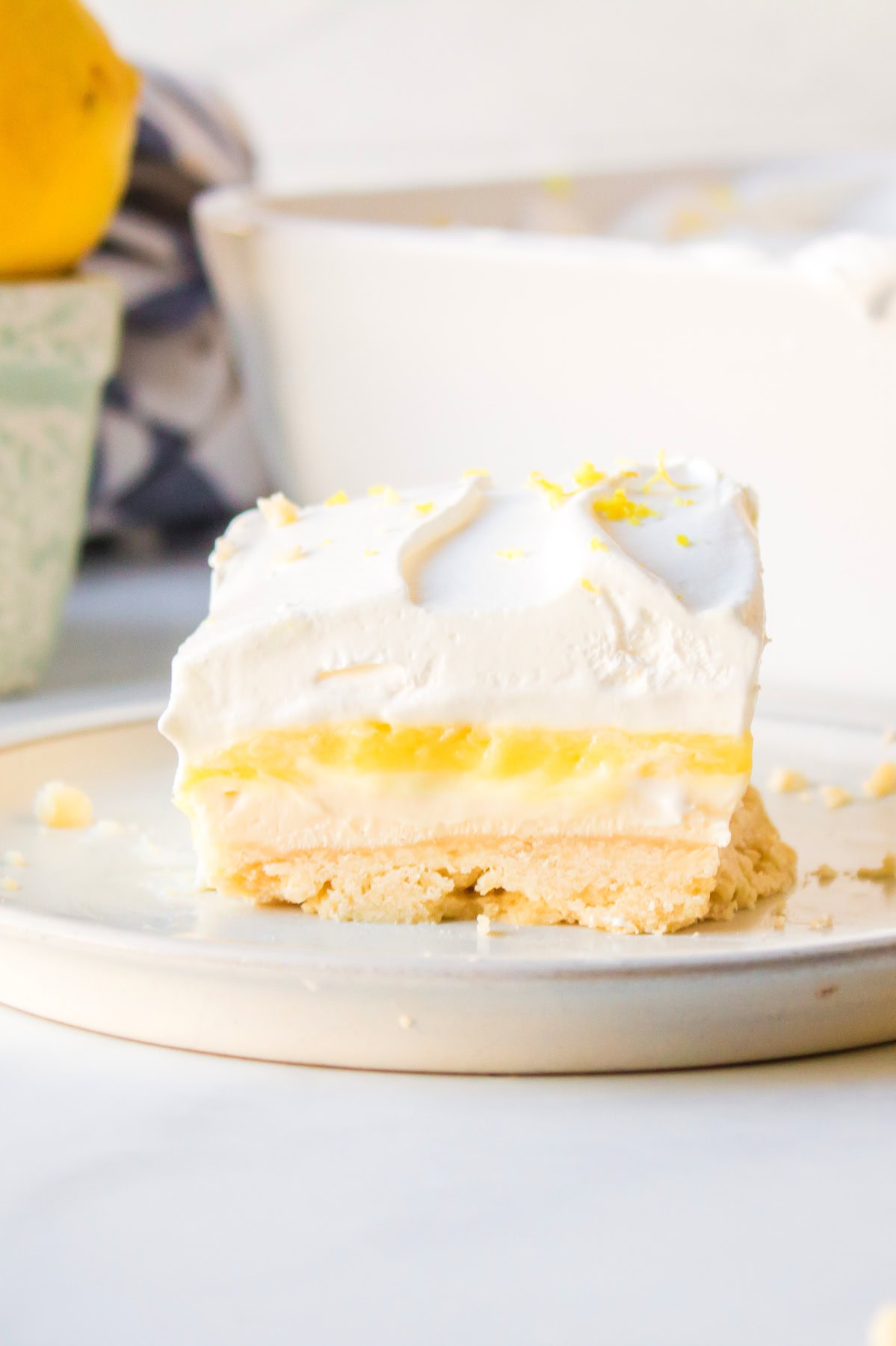 serving of lemon lush dessert on plate