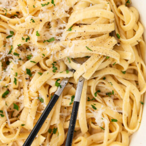 authentic alfredo sauce in a bowl with servers