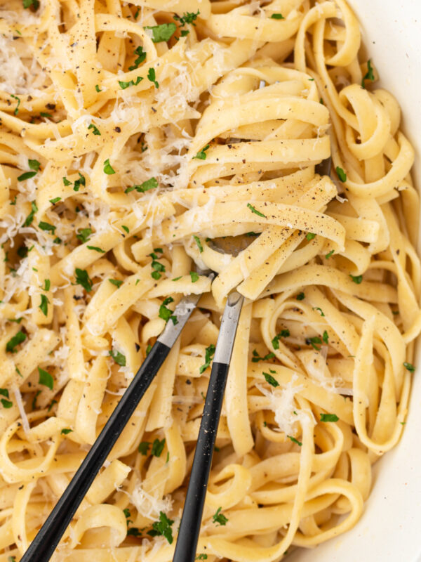 authentic alfredo sauce in a bowl with servers