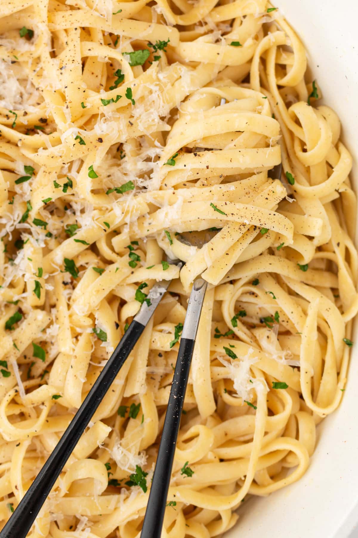 authentic alfredo sauce in a bowl with servers