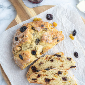 sweet irish soda bread loaf on board sliced open