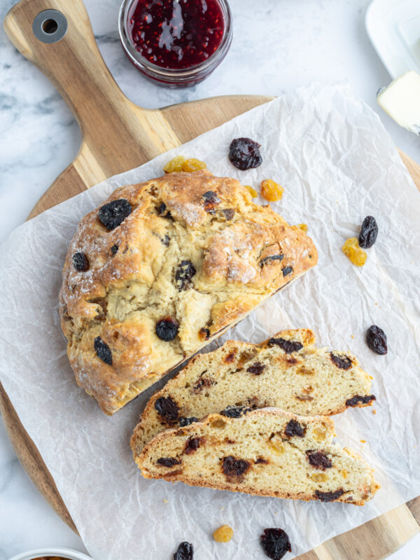 sweet irish soda bread loaf on board sliced open