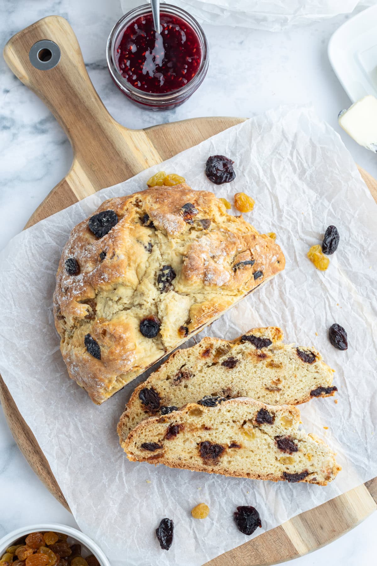 sweet irish soda bread loaf on board sliced open